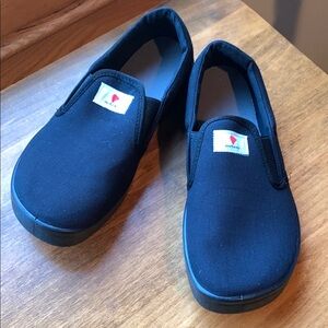 Anotomic black canvas slip ons. Similar to Vans but with a wide toe box